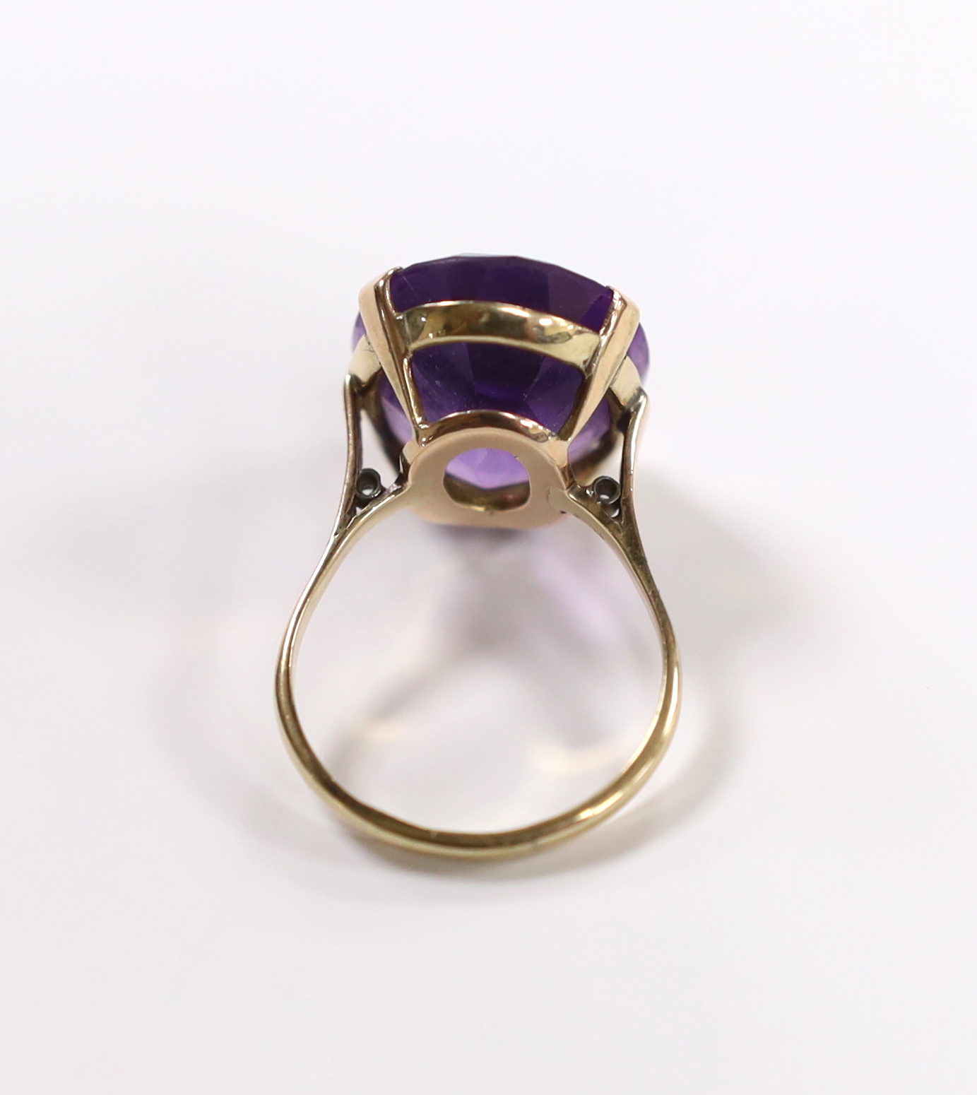 A 9ct and single stone oval cut amethyst set dress ring, size R/S, gross weight 7.5 grams.